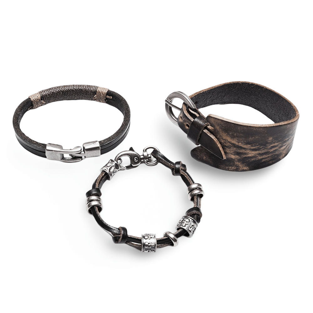 Vintage leather punk bracelet set featuring skull beads, textured cowhide and metal for a rebellious style.