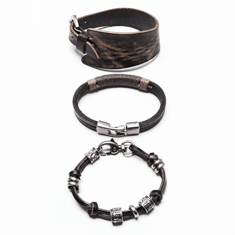 Vintage leather punk bracelet set featuring skull beads and metal accents for a rebellious style.