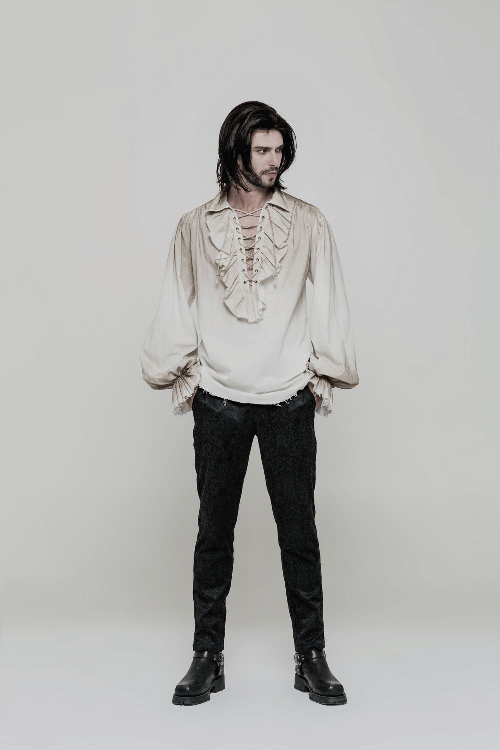 Model wearing a vintage linen pirate shirt with eyelet lace-up front, styled for a retro steampunk look.