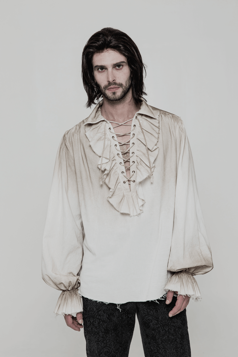 Vintage linen pirate shirt with eyelet lace-up front, retro style with long sleeves and ruffled cuffs.