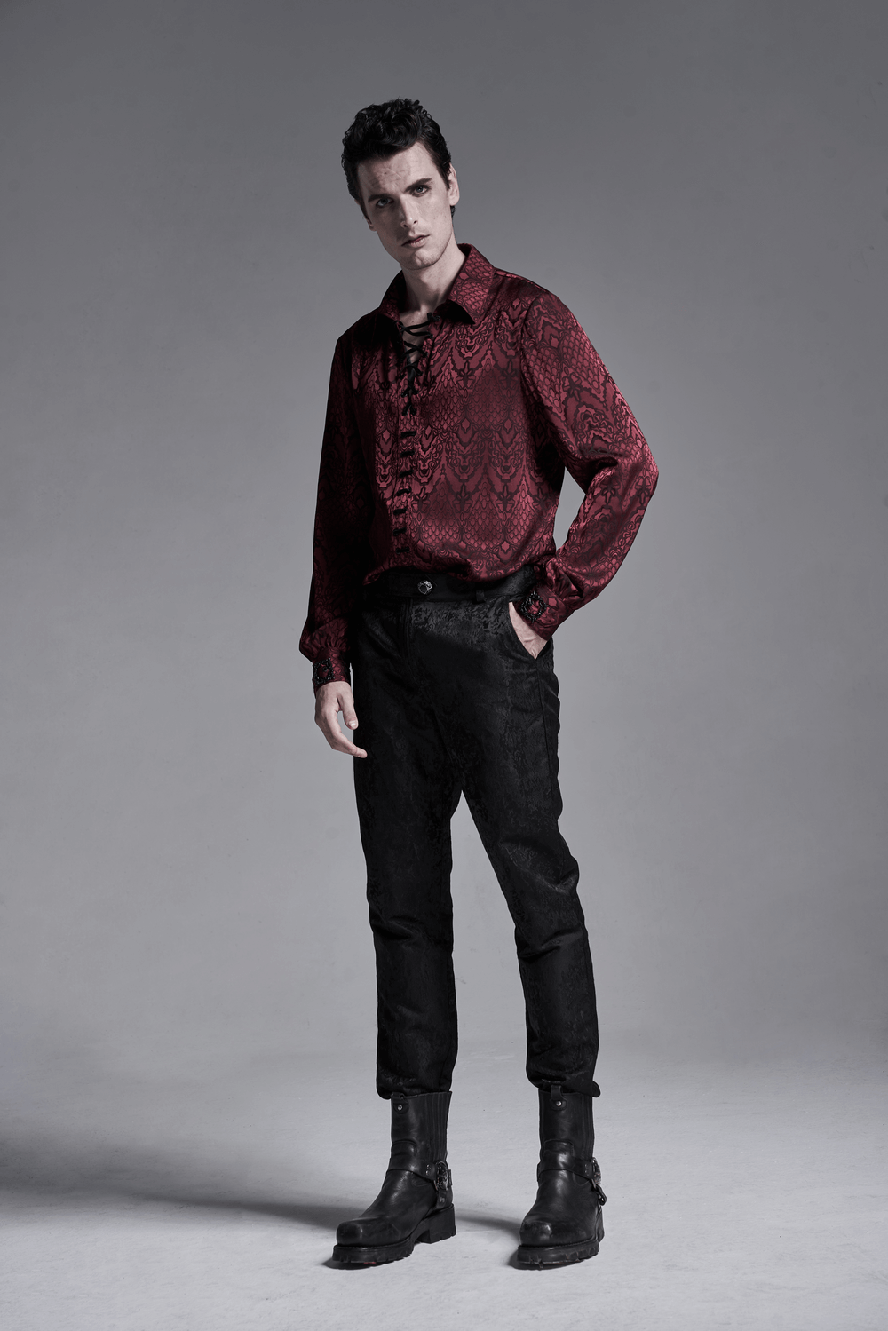 Men's vintage gothic lace-up shirt in dark red with jacquard pattern and black pants, embodying dark elegance.