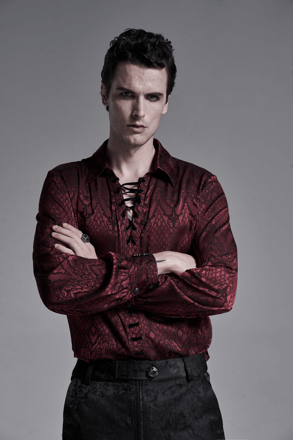 Men's vintage Gothic lace-up shirt in deep red with intricate jacquard pattern, exuding dark elegance and style.