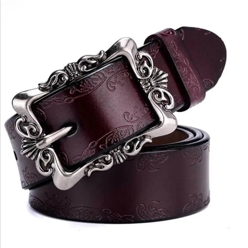 Vintage luxury women's genuine leather belt with ornate silver buckle, perfect accessory for stylish jeans outfits.