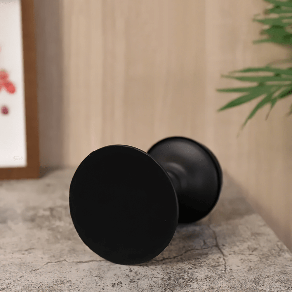 Vintage matte black Nordic iron candle holder on a stone surface, perfect decor for modern or gothic themes.