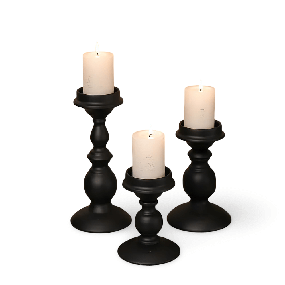 Vintage matte black Nordic iron candle holders with white candles for stylish home decor.