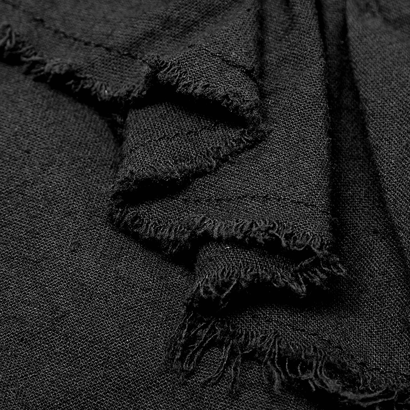 Close-up of the ruffled front detail on a vintage Gothic shirt, showcasing distressed fabric for a steampunk aesthetic.