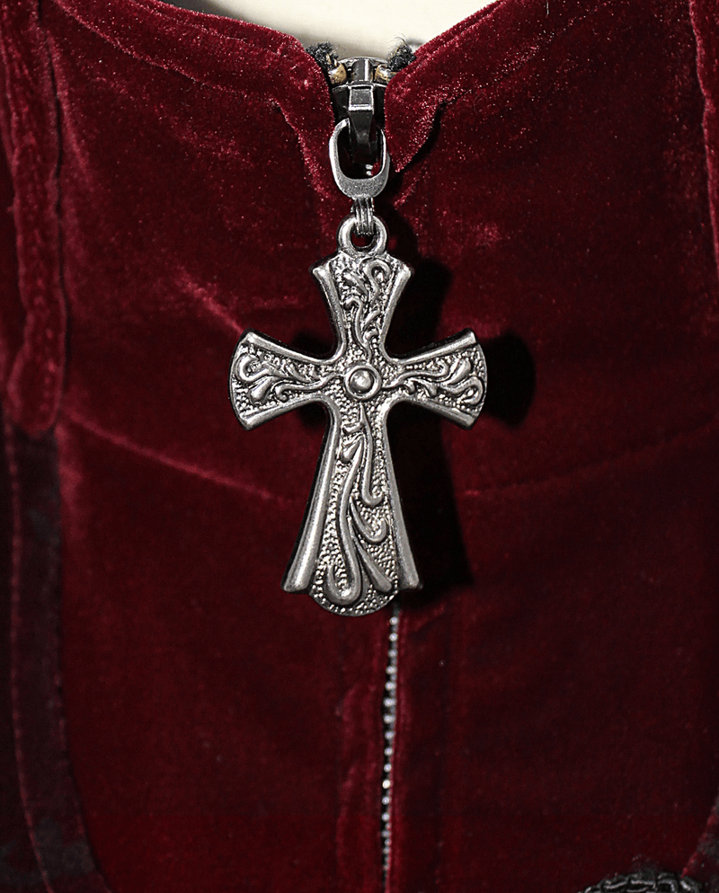 Close-up of the stylish cross zipper pull on a vintage men's wine red velvet coat.