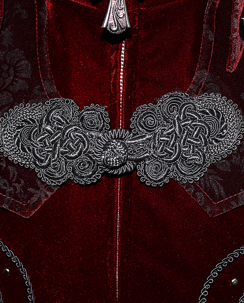 Close-up of the intricate silver cross accents on a vintage men's wine red velvet coat.