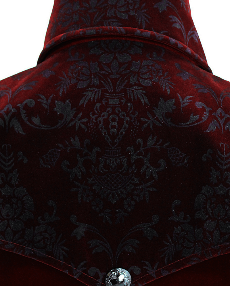 Close-up of vintage men's wine red velvet coat showcasing intricate black floral patterns.