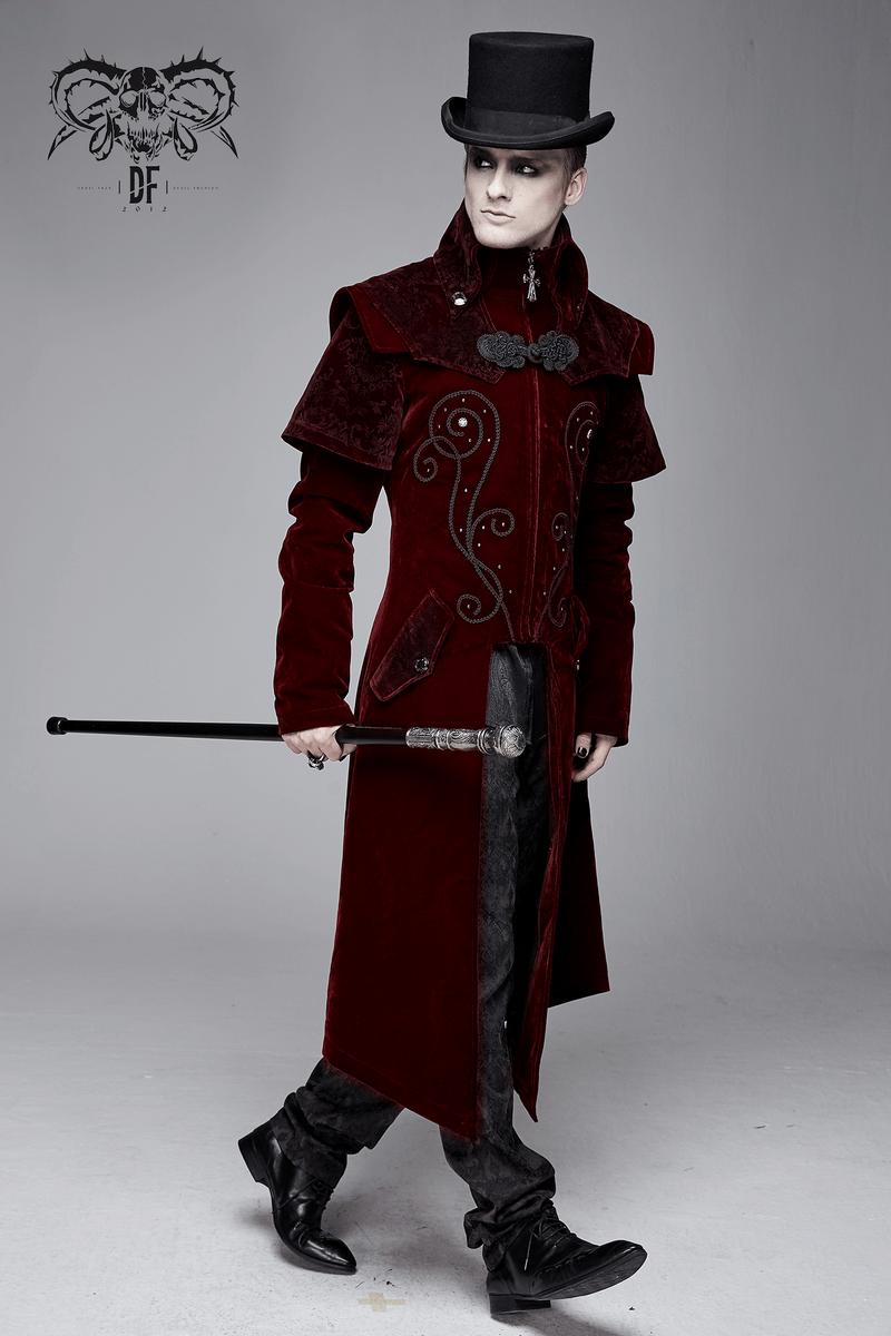 Stylish model in a vintage wine red velvet coat with gothic design and top hat, showcasing a unique look.