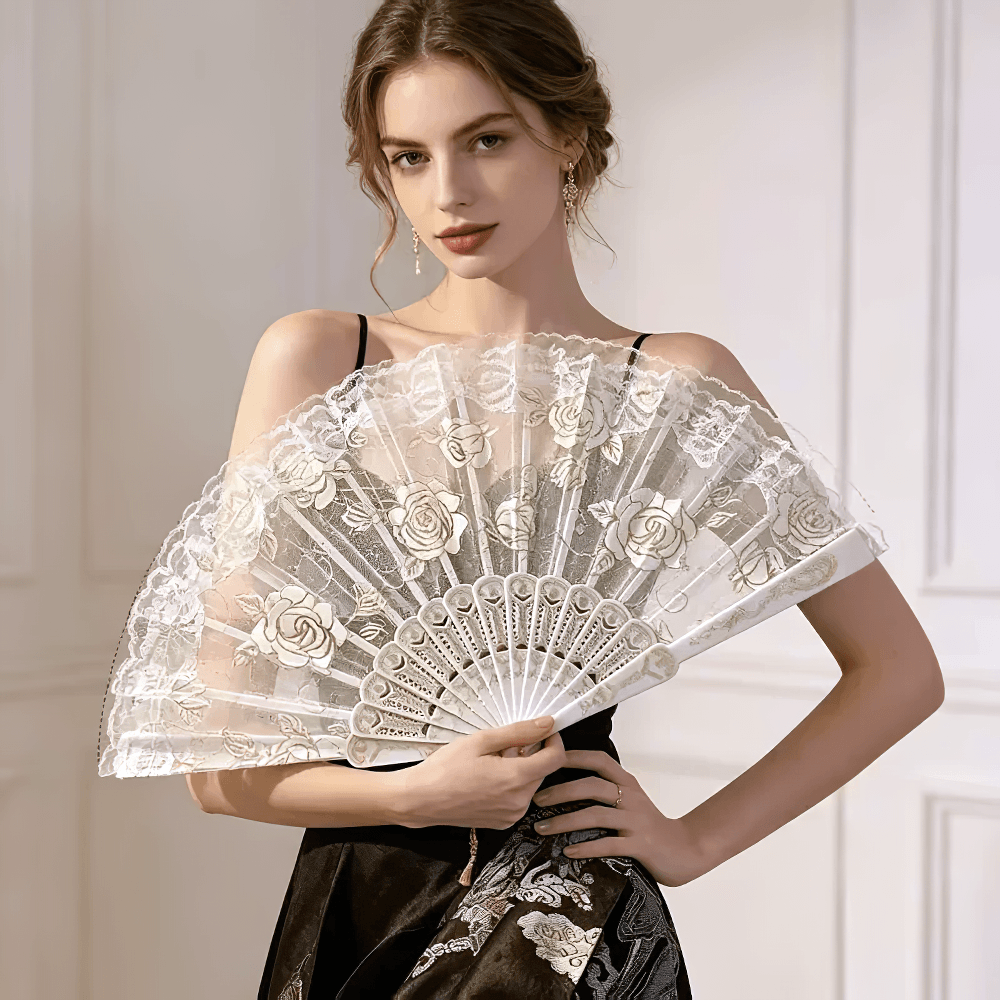 Vintage Rose Lace Folding Fan with Tassel Pendant held by a model, showcasing its ornate Gothic design.