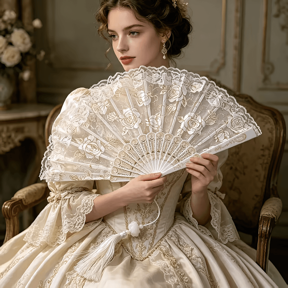 Vintage Rose Lace Folding Fan with Tassel Pendant held by a woman in a vintage gown, showcasing lace and intricate floral designs.