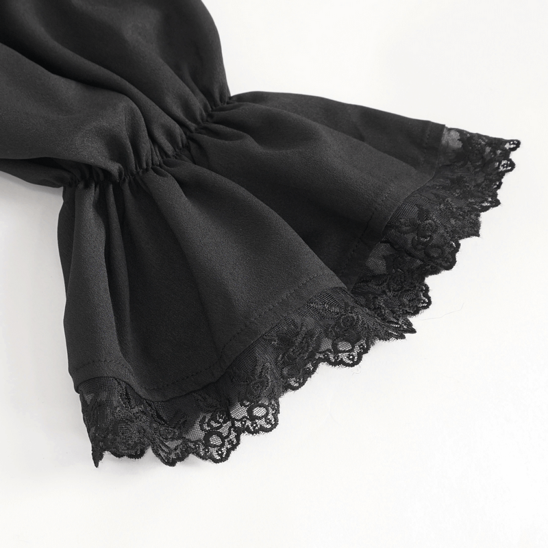 Close-up of vintage ruffle sleeves with lace trim on a sleek black shirt, showcasing unique style and elegance.