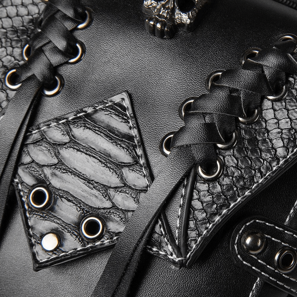Close-up of vintage black leather bag with skull detail, braided texture, and punk style accents.