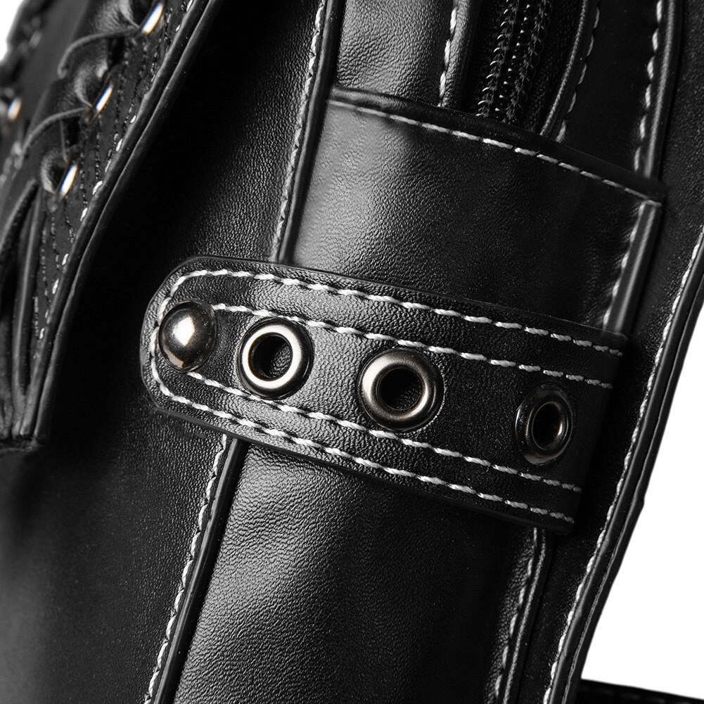 Close-up of black PU leather bag showcasing rivets and stitching, ideal for gothic or steampunk fashion.