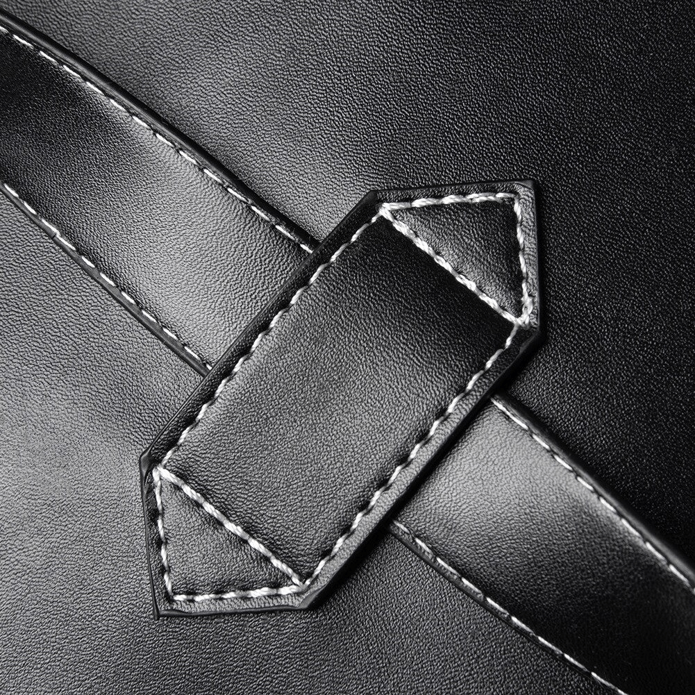 Close-up of the black PU leather strap detail on a vintage skull multifunction bag.