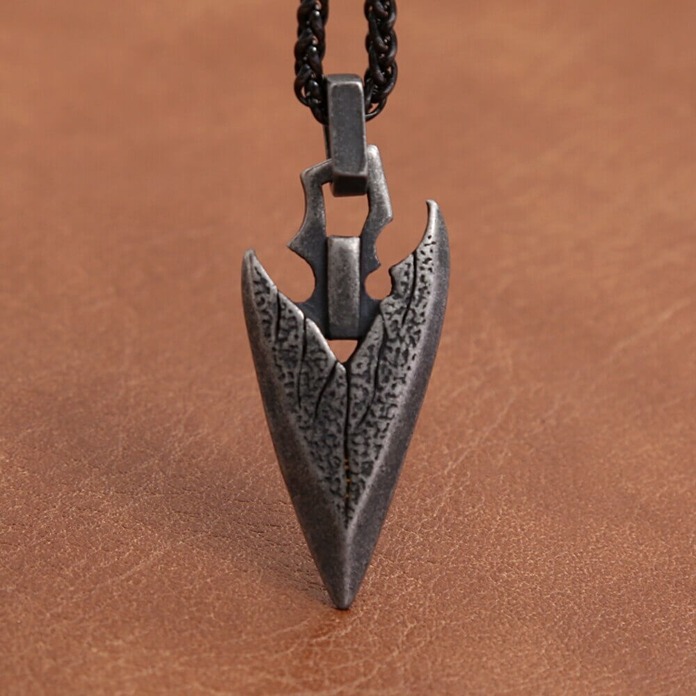 Vintage stainless steel arrowhead pendant necklace, a bold unisex fashion amulet accessory.