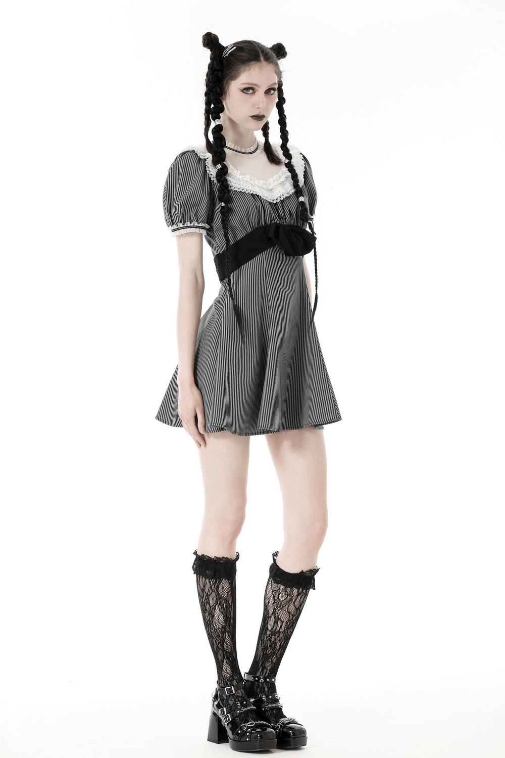 Vintage striped dress with lace and bow detail, perfect for a stylish yet feminine look.