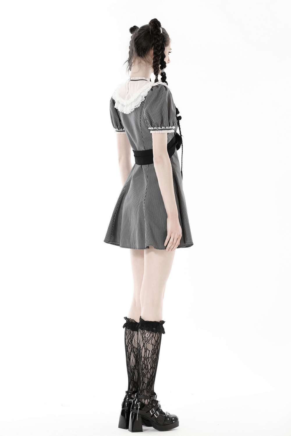 Side view of a vintage striped dress with lace collar and bow, showcasing a flattering silhouette and stylish accents.