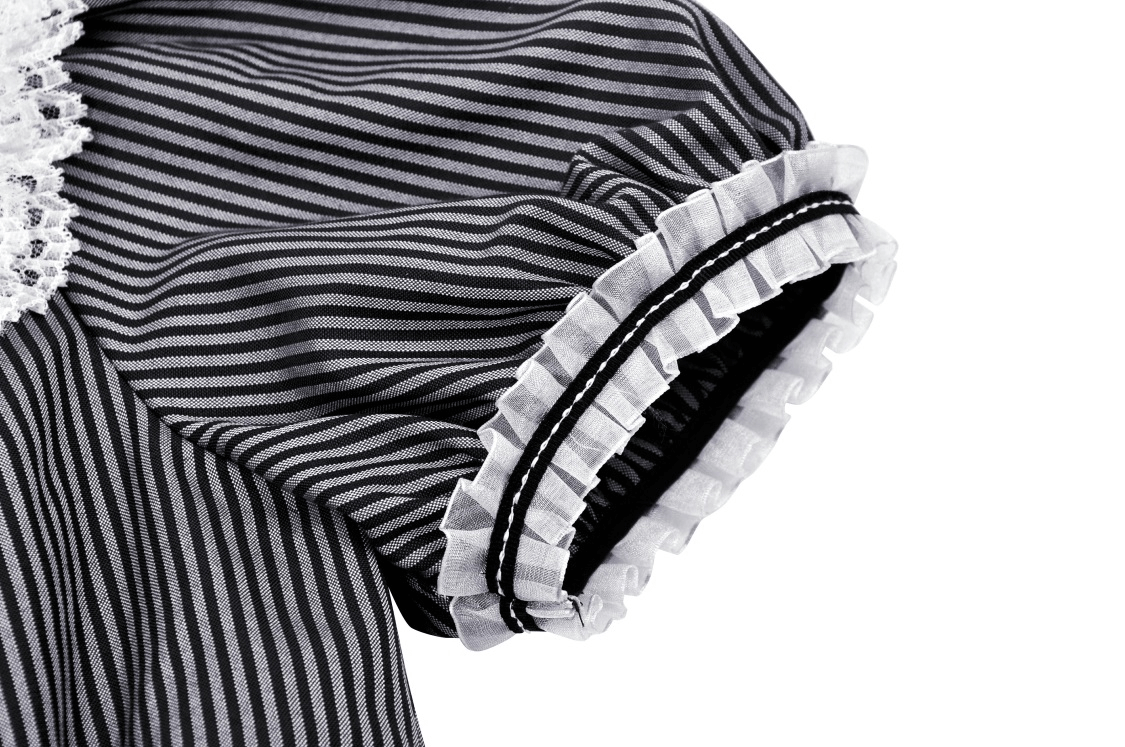 Close-up of vintage striped dress sleeve featuring lace trim and playful ruffle detail for a feminine touch.