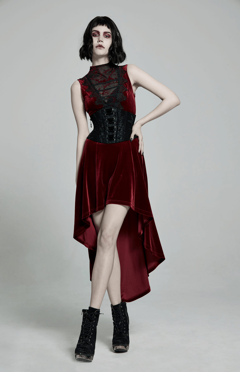 Model showcasing a vintage velvet cincher with lace-up back and zipper, paired with a gothic dress.