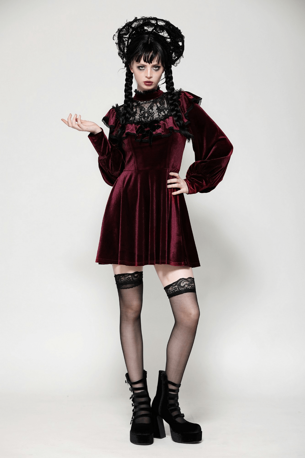 Gothic vintage velvet dress in burgundy with black lace trim, ruffles, and puff sleeves, styled for a mysterious look.