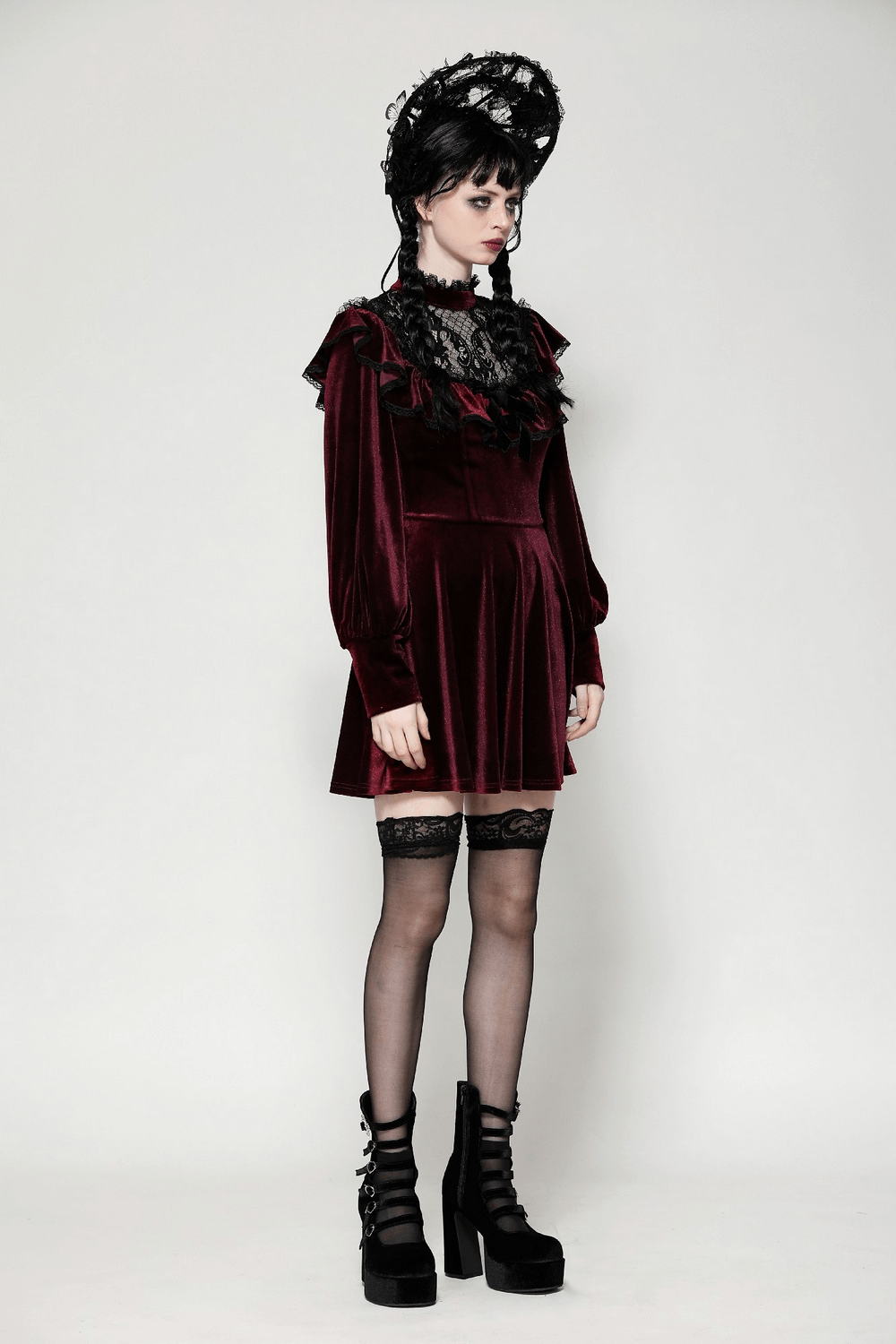 Gothic vintage velvet mini dress in burgundy with black lace trim, ruffles, and puffed sleeves, styled with platform boots.