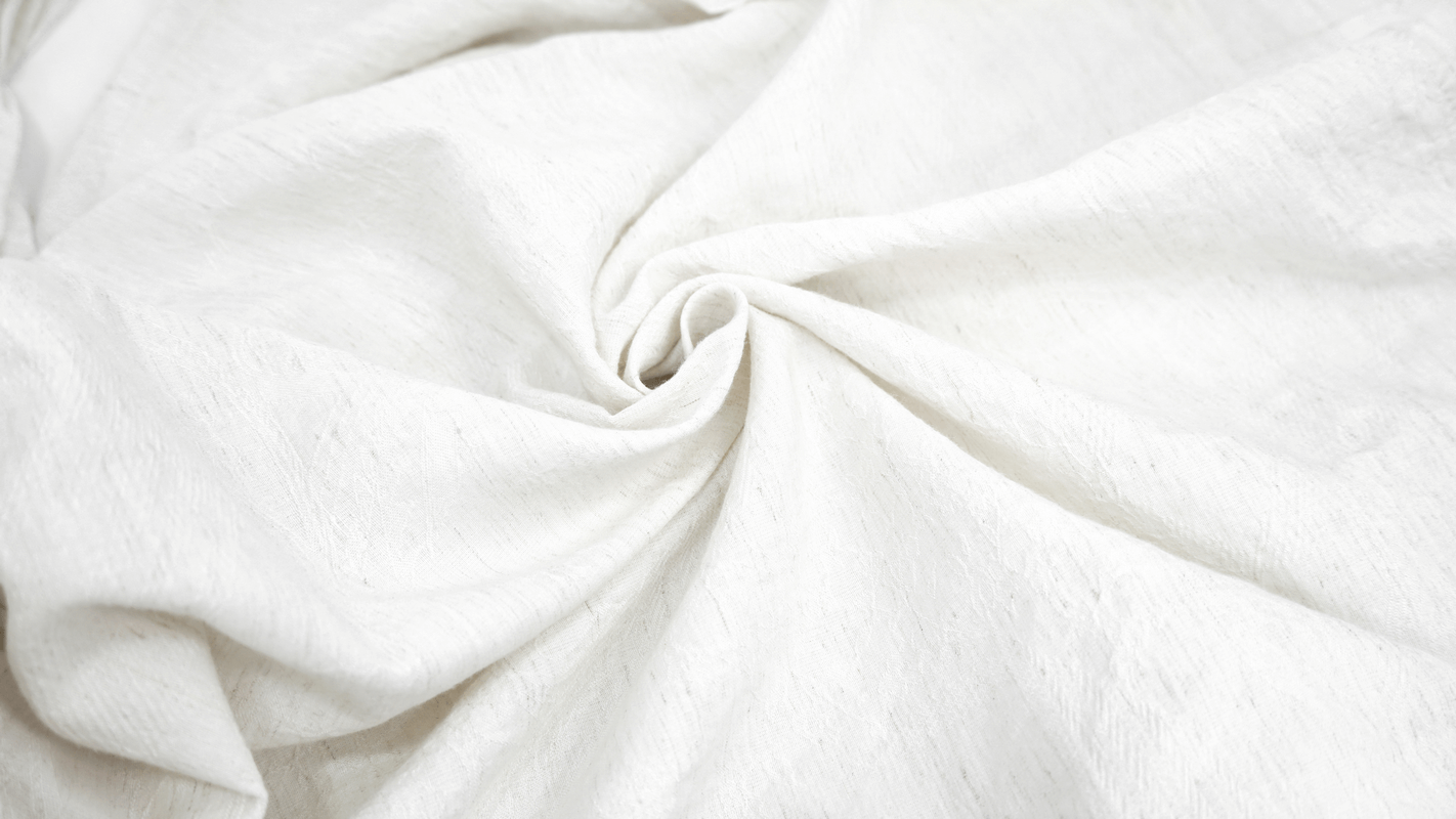 Close-up of soft, textured white fabric, perfect for vintage gothic shirts with ruffles and flared cuffs.