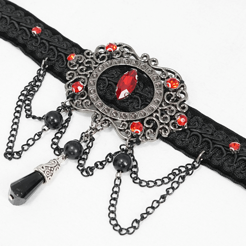 Elegant vintage women's black choker with chains and blood-red stones in gothic style.