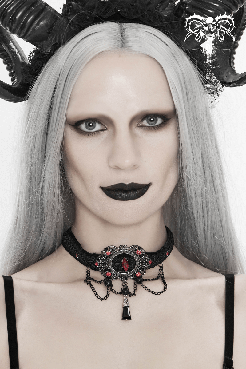 Stylish vintage women's choker with chains and blood-red stones in gothic design, worn by model with striking makeup.