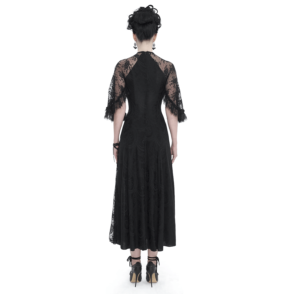 Back view of a vintage women's lace long dress with elegant fringe sleeves and a flowing silhouette, exuding gothic charm.