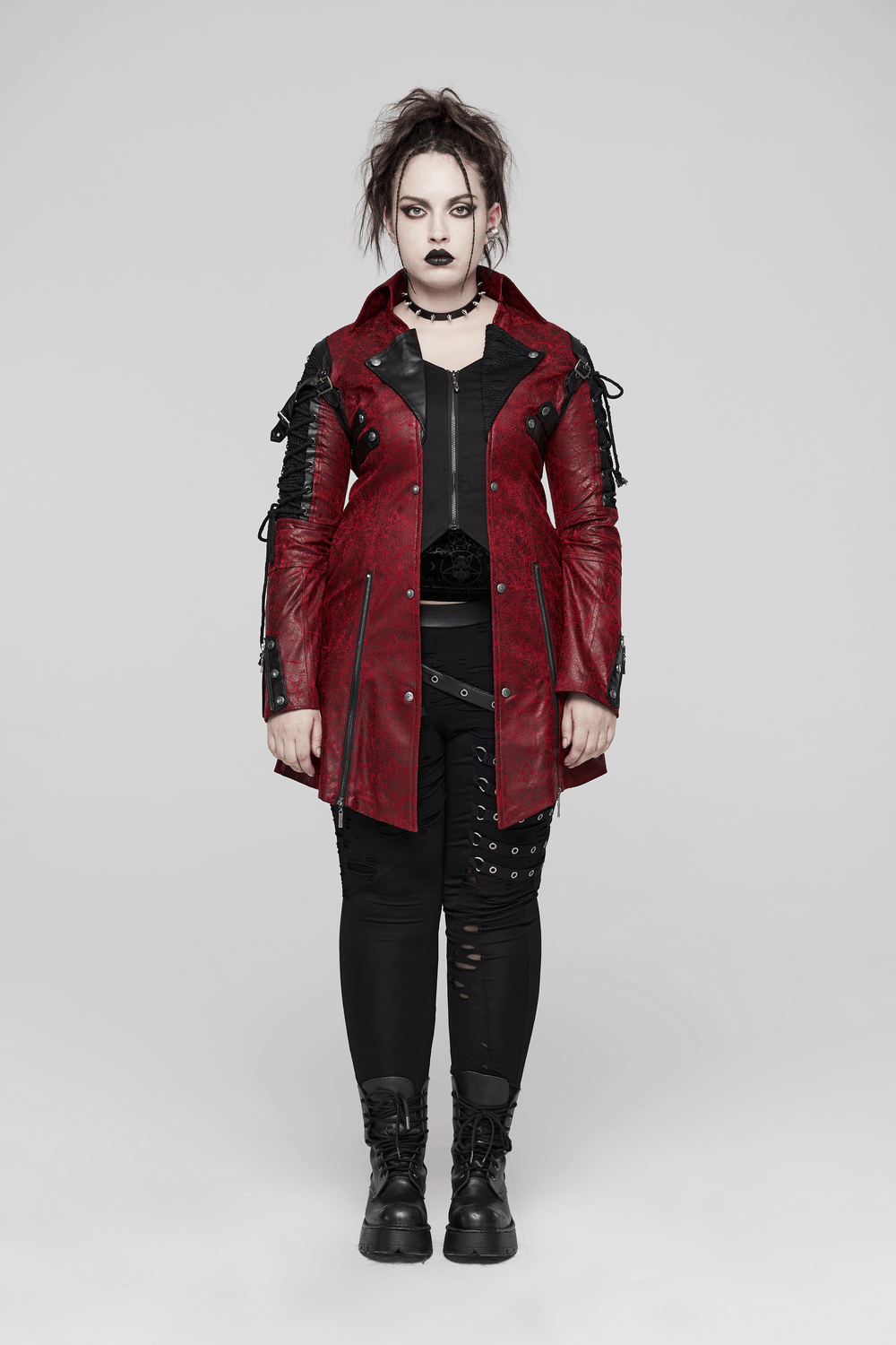 Vintage red leather punk jacket with straps, featuring rubber sleeves for a bold gothic look.