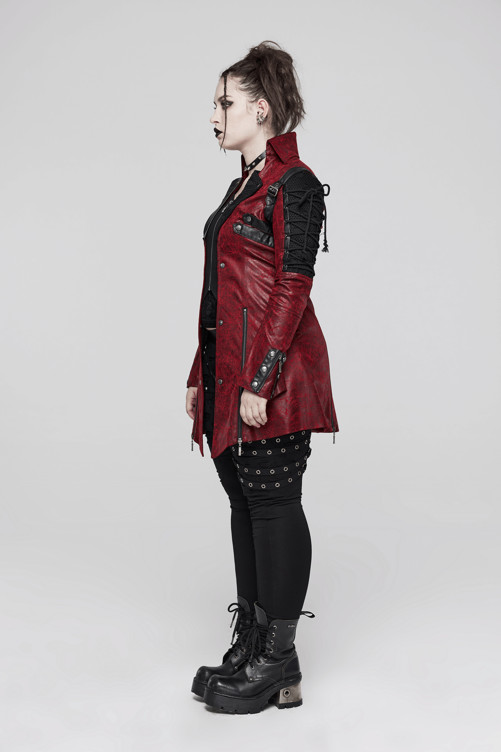 Vintage women's red leather punk jacket with rubber sleeves and adjustable straps, showcasing a bold gothic style.