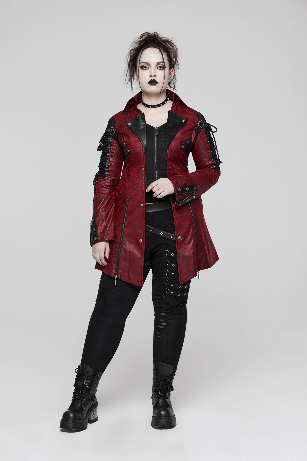 Vintage women's red leather punk jacket with rubber sleeves and adjustable straps, perfect for a goth-inspired look.