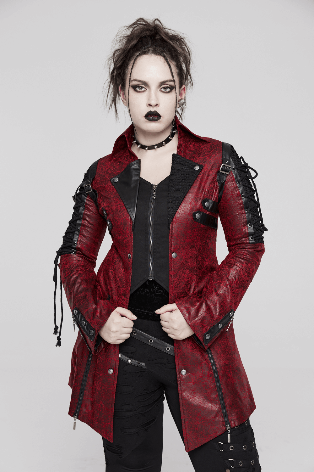 Model in a vintage red leather punk jacket with straps, showcasing a unique gothic style and edgy fashion.