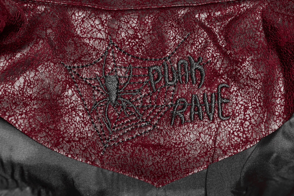 Close-up of the red leather Punk Rave jacket showcasing spider embroidery detail.