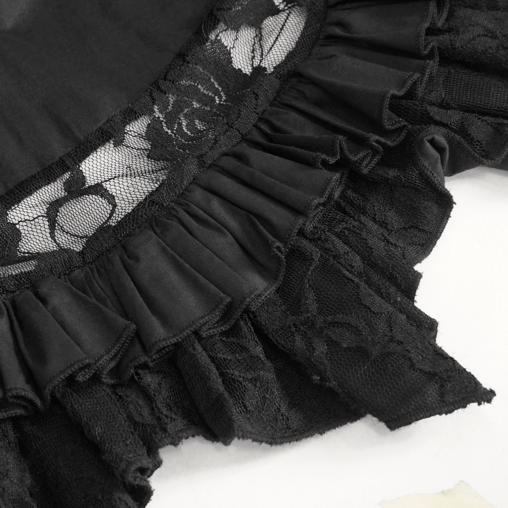 Close-up of the vintage women's gothic black blouse with lace inserts and ruffles for an elegant touch.