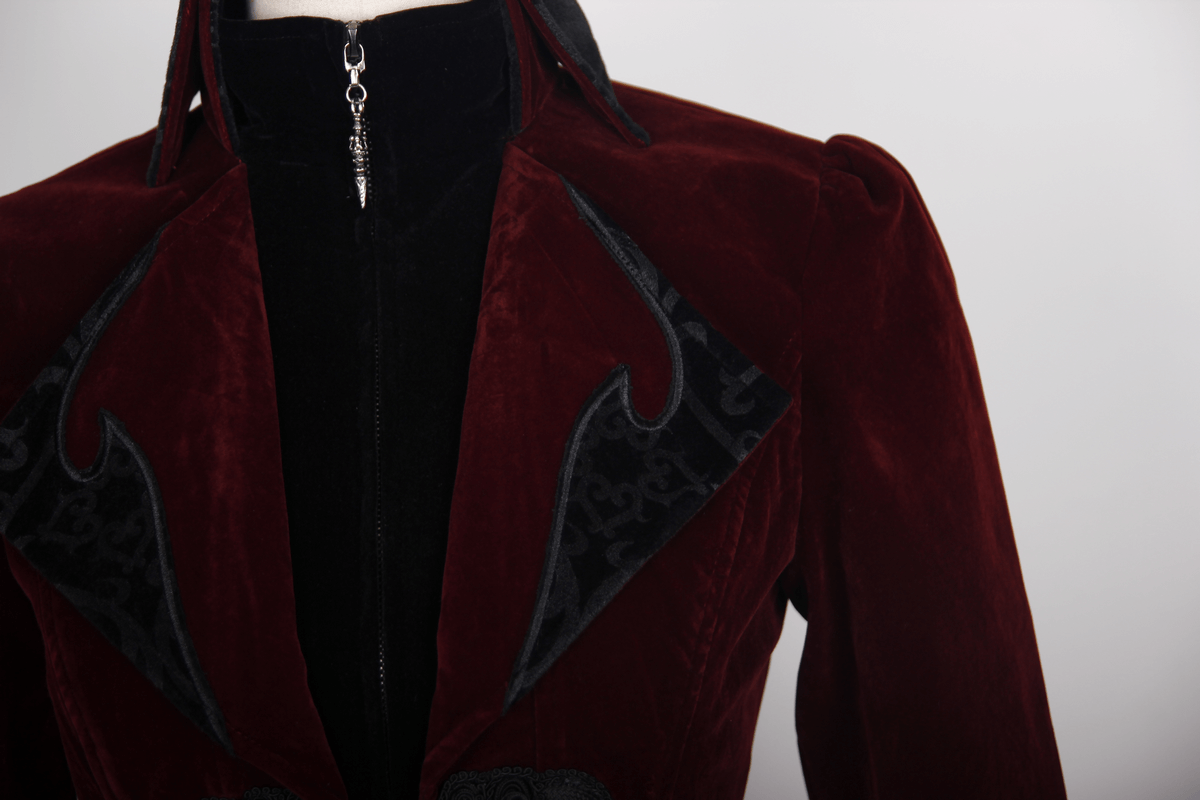 Close-up of a vintage women's burgundy steampunk coat with gothic embroidery and stylish zippers.