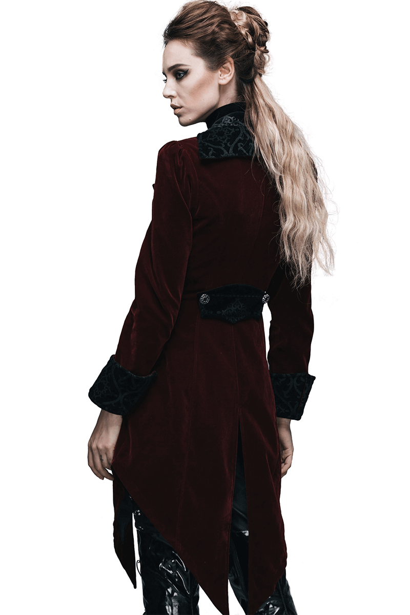 Model showcasing a vintage gothic burgundy velvet coat with intricate embroidery and a stylish fitted cut.