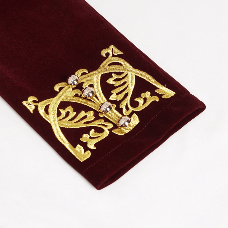Close-up of gold embroidery detail on wine red vintage tailcoat sleeve with decorative buttons.