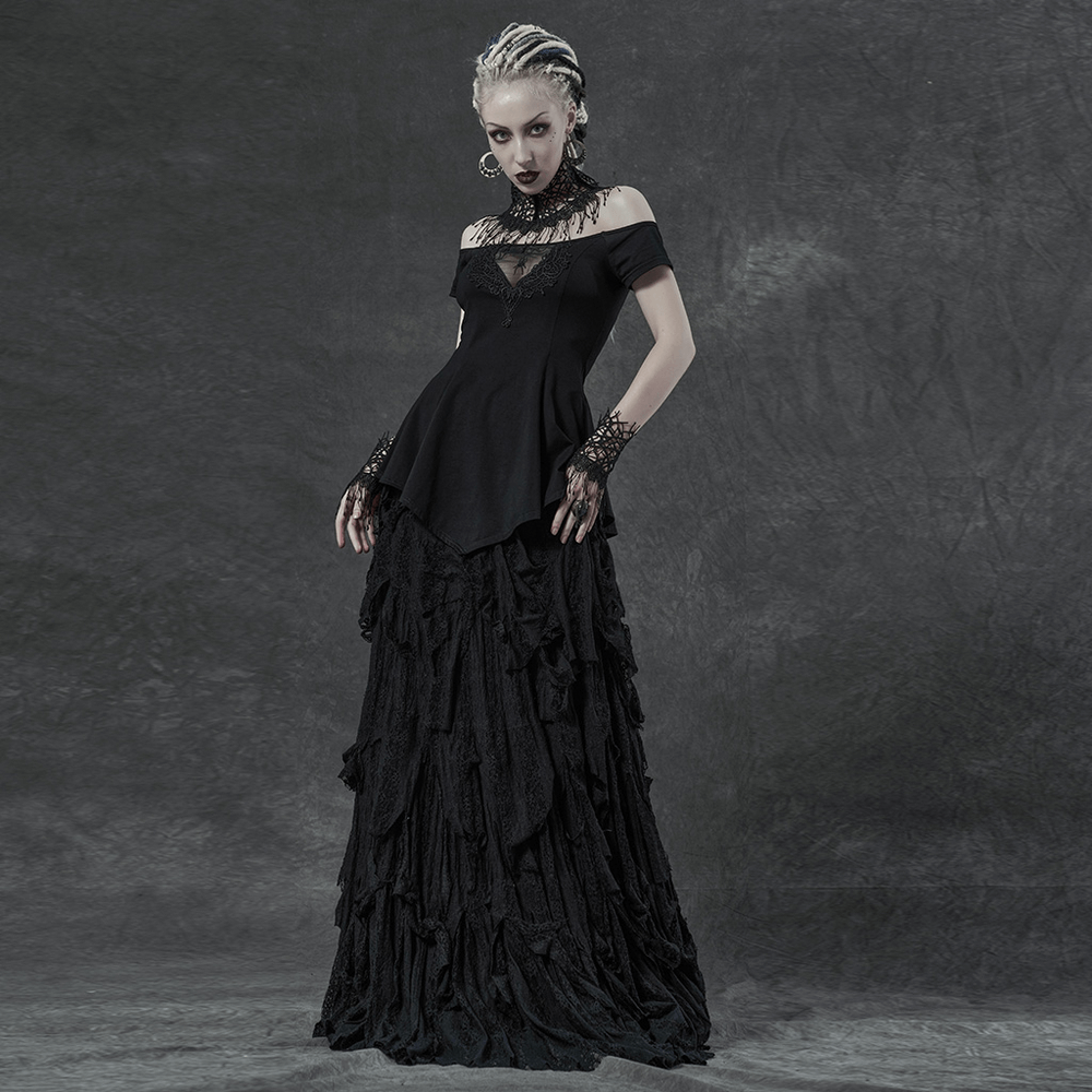 Elegant model in off-shoulder black floral embroidery top and layered black skirt, showcasing a gothic chic style.