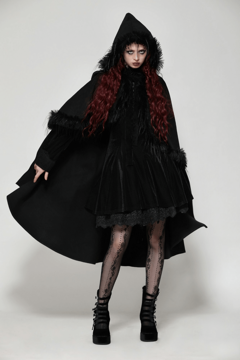 Elegant black hooded cape with faux fur trim, perfect for gothic fashion and dramatic looks. Ideal for cosplay and festivals.