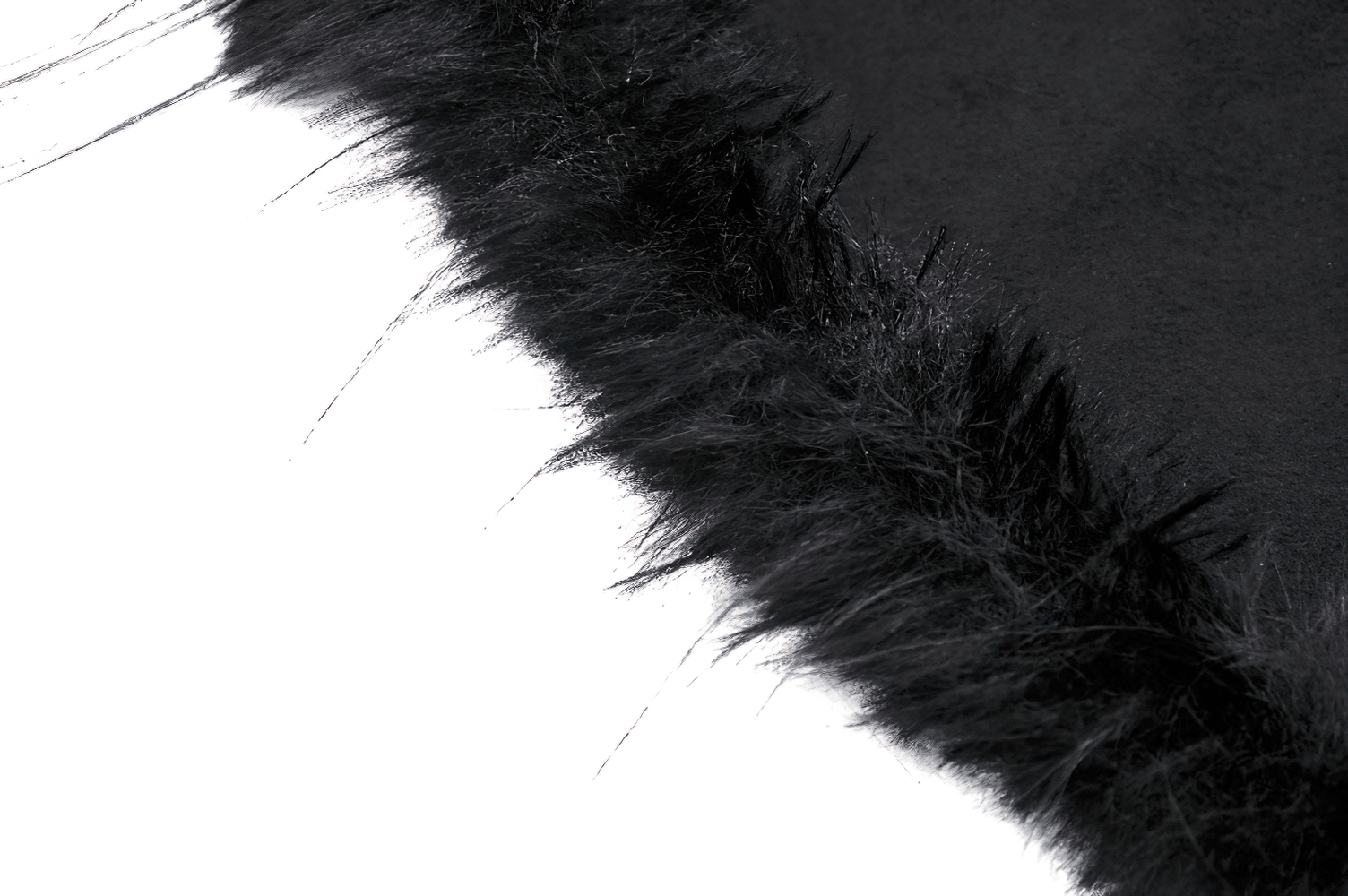 Close-up of soft black faux fur trim on a dramatic hooded cape, highlighting its elegant gothic flair.