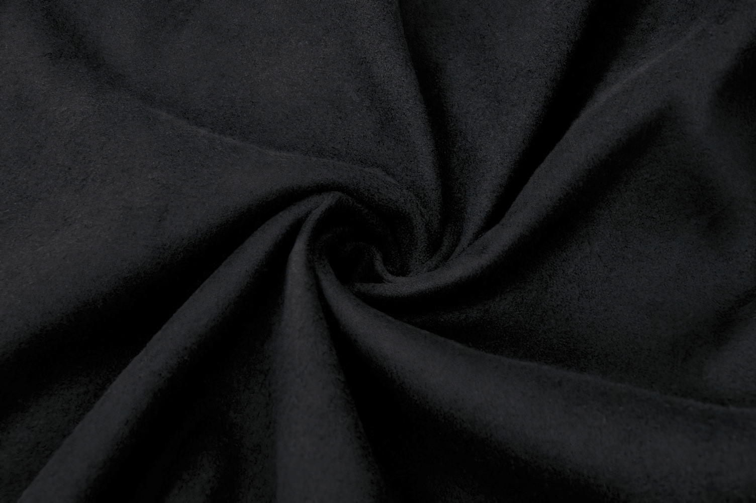 Close-up of soft black fabric, showcasing its smooth texture, perfect for gothic clothing designs.