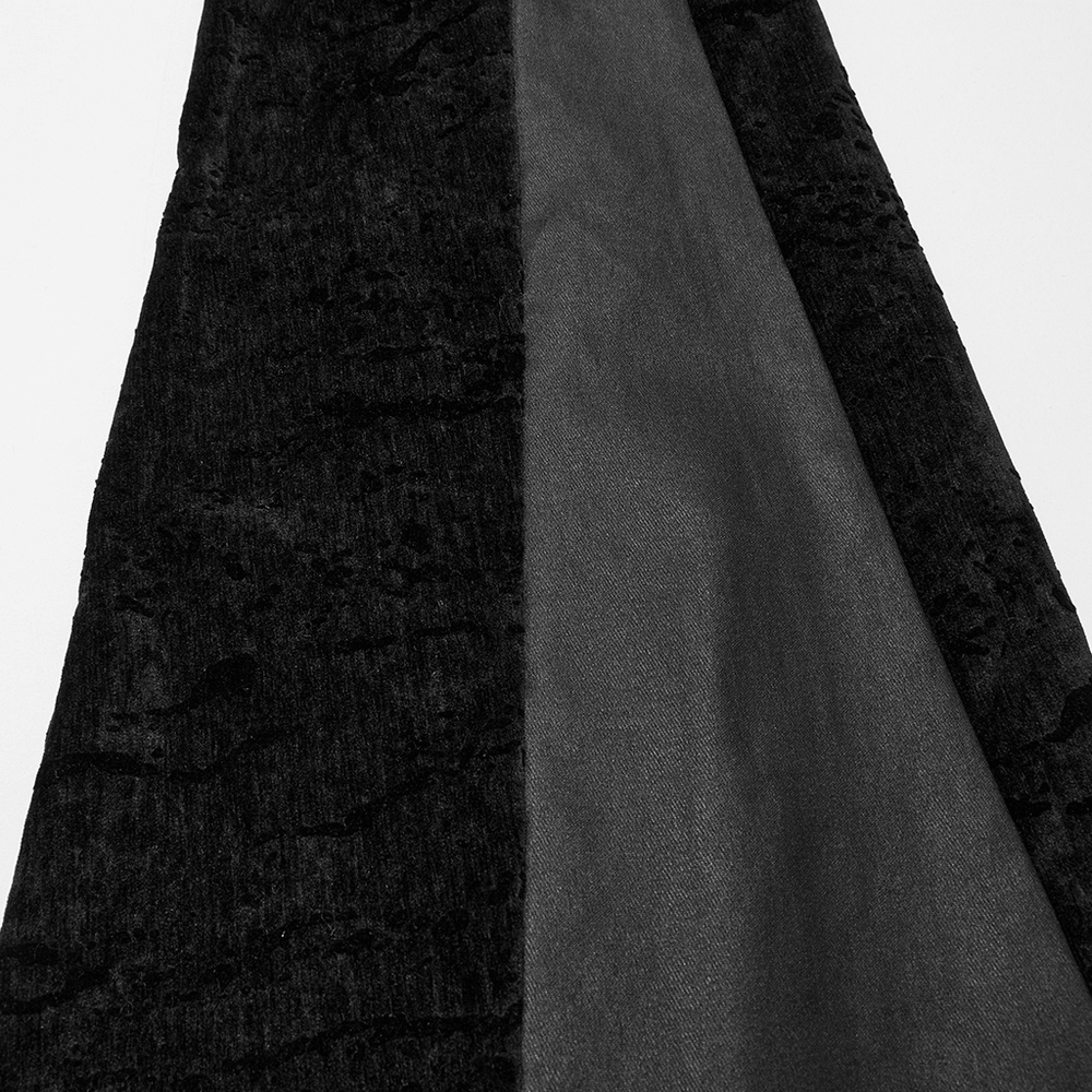 Close-up of Wasteland Black Tassel Flare Pants showcasing velvet detailing and sleek fabric splicing.