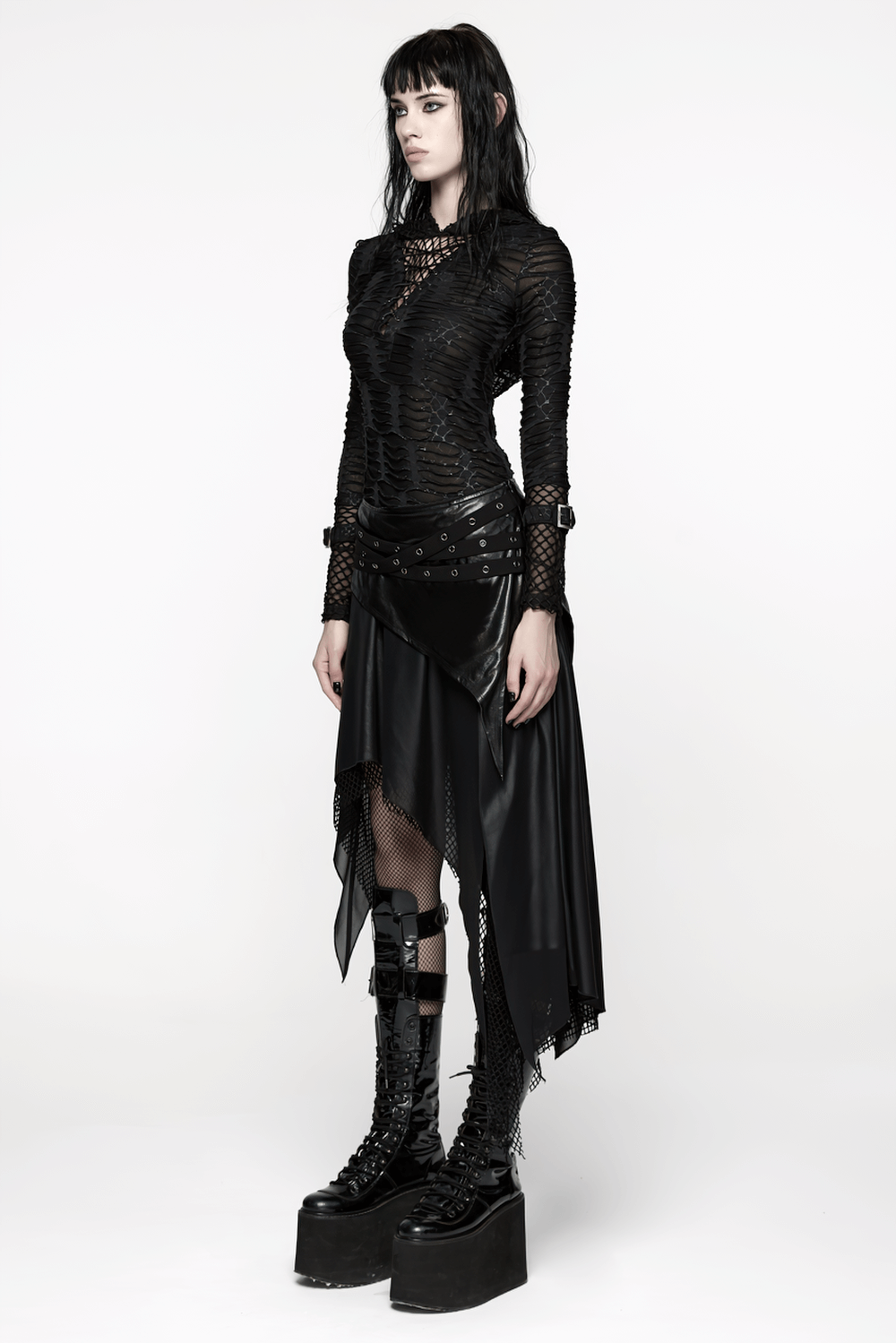 Wasteland Punk Skirt with Mesh and Faux Leather Design worn by a model with platform boots.