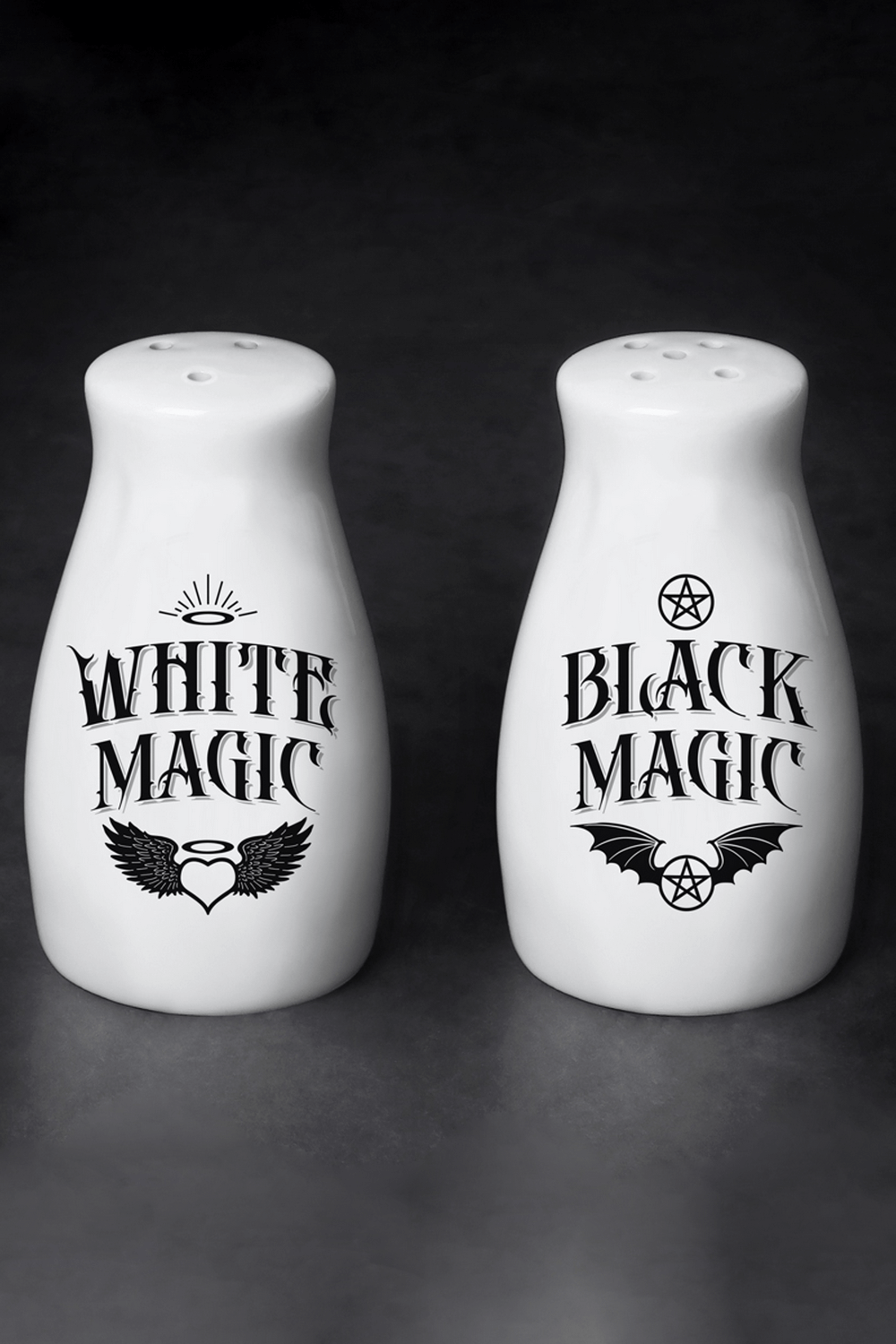 Gothic White and Black Magic salt and pepper shaker set with angel and bat designs, adding spooky charm to your kitchen.