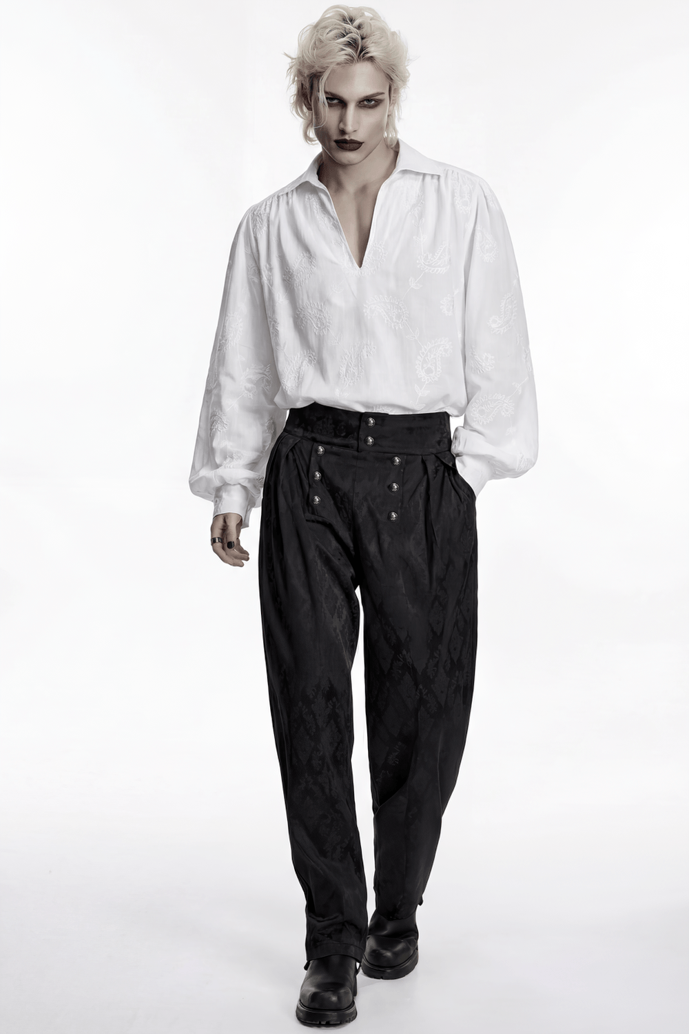 White Gothic Embroidered Loose Shirt with Puff Sleeves styled with black brocade trousers and accessories.
