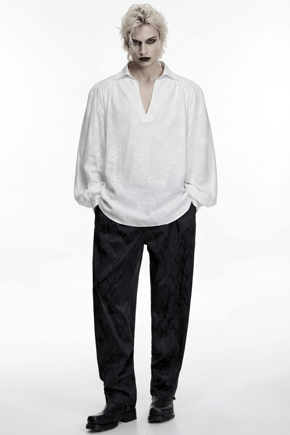 White Gothic Embroidered Loose Shirt with Puff Sleeves styled with dark trousers and edgy accessories.