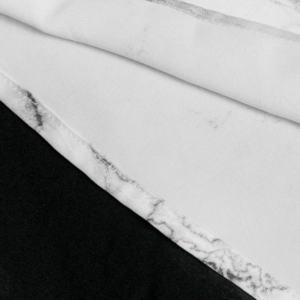 Close-up of White Gothic Marble Shirt with Lace Ruffle Bib fabric featuring marble print and black accents.